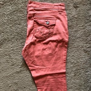 Coral colored cropped jeans